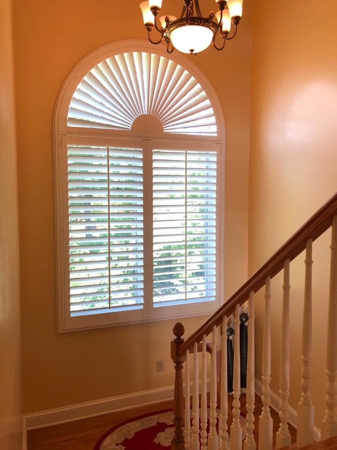 Custom arch shutter installation by Carolina Blinds